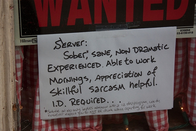 You can start communicating your expectations right in your job posting, as in this French Quarter helped wanted sign looking for a server. Photo by Bryan Nabong, used under Creative Commons terms.