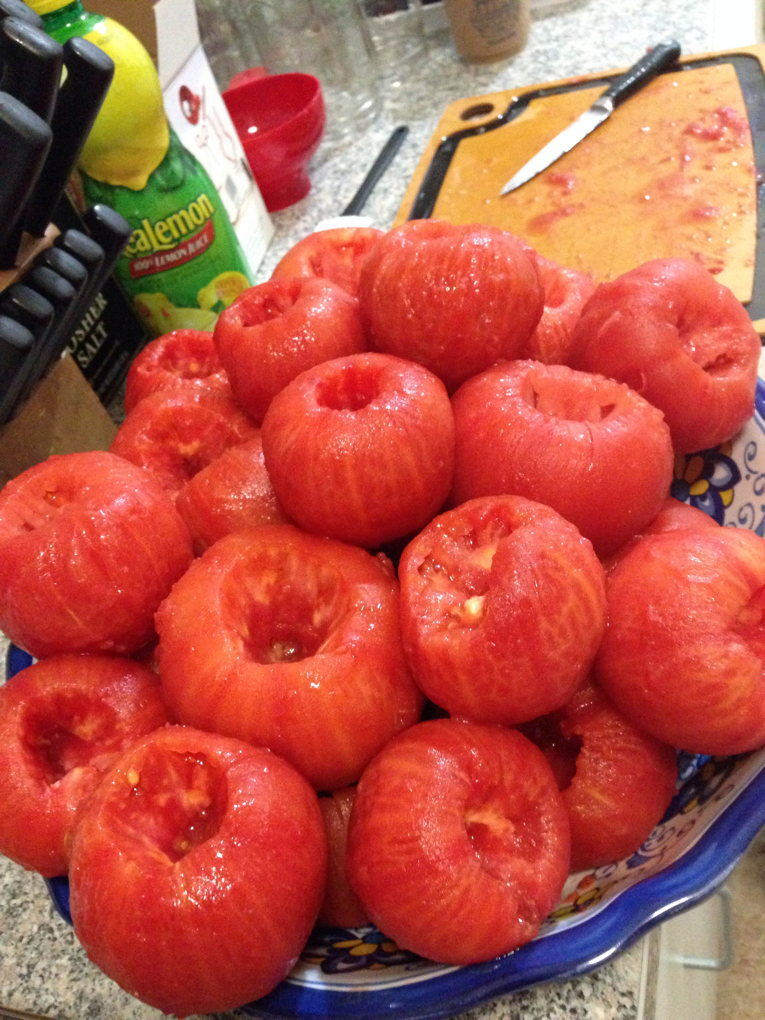 Before canning, you have to boil the tomatoes for a few minutes, called blanching, to peel the skin off. They also have to be cored.